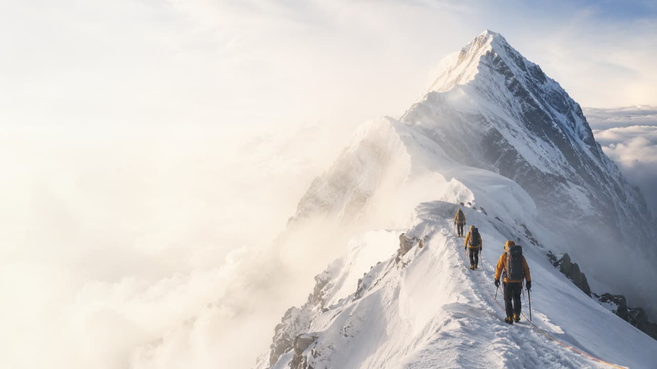 Climbers on a Himalayan snow ridge; illustrative image, not Ramjak Peak