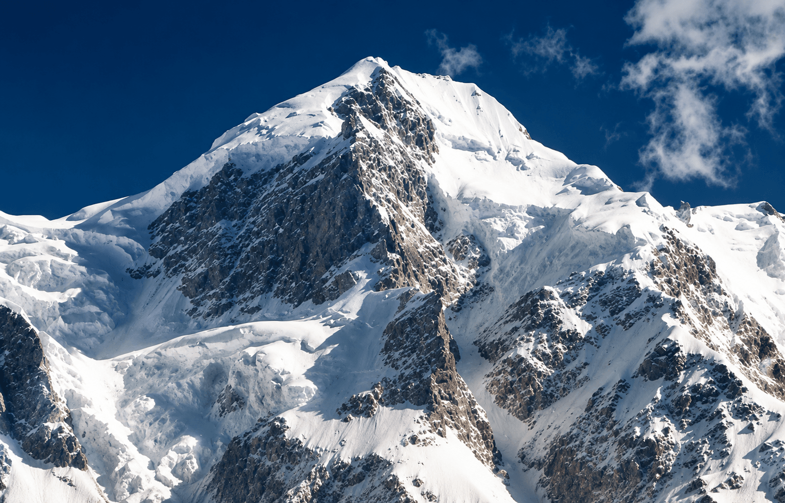 Snow-covered Himalayan summit during a guided 7000 meter expedition in India